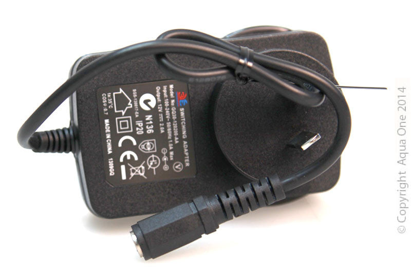 Black power adapter with certification labels on a white background
