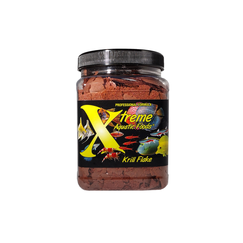 A clear container of Xtreme 99g Krill Flake fish food, showing the product name and description, alongside a label showing various fish and the size of the flakes.
